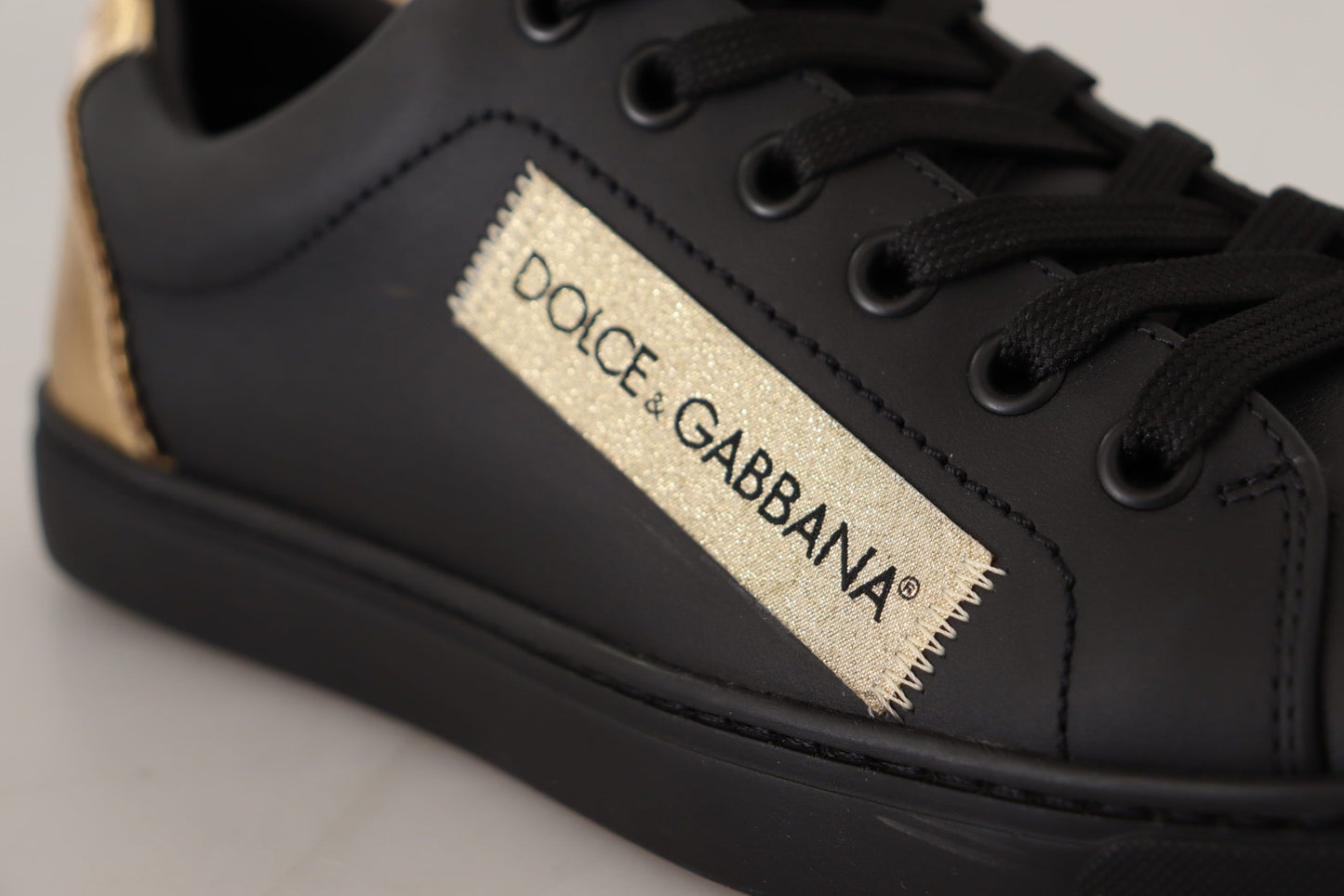 Baskets basses Dolce & Gabbana en cuir noir et doré pour femme