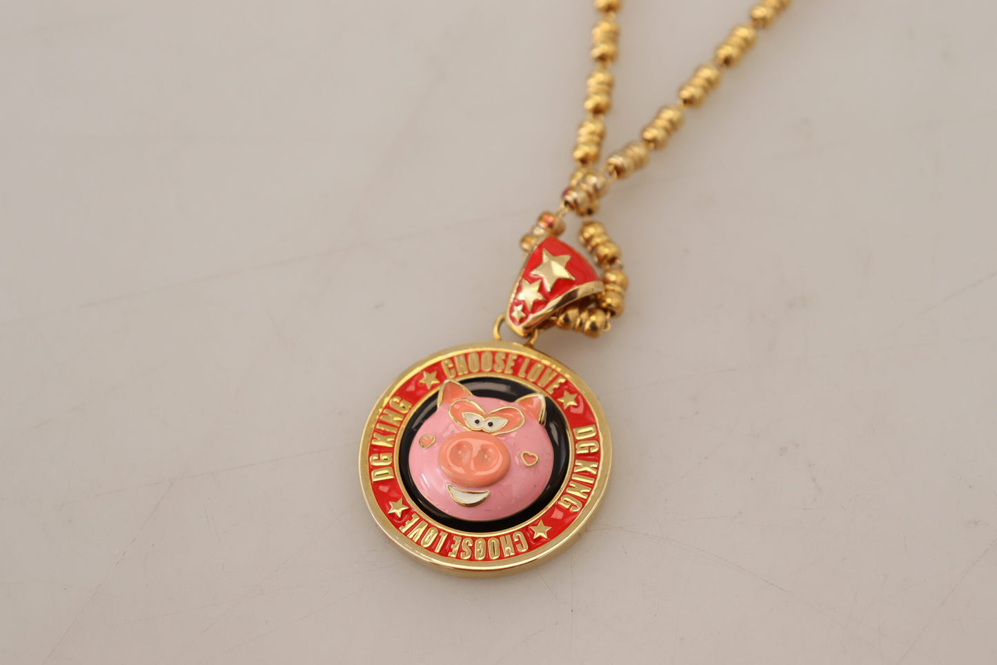 Collier Dolce & Gabbana avec pendentif logo SUPER PIG en laiton doré