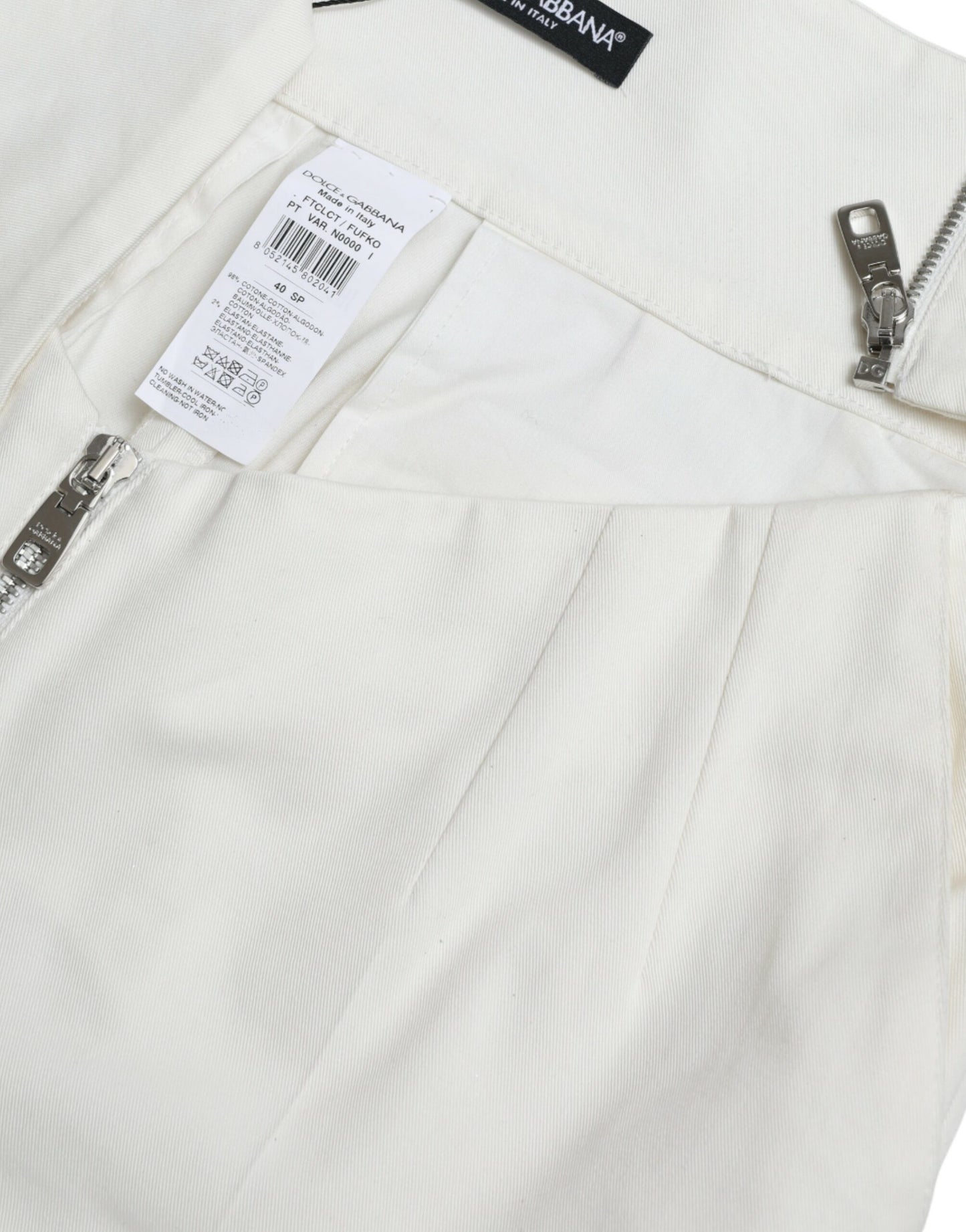 Pantalon fuselé en coton noir et blanc Dolce & Gabbana avec découpes à la taille