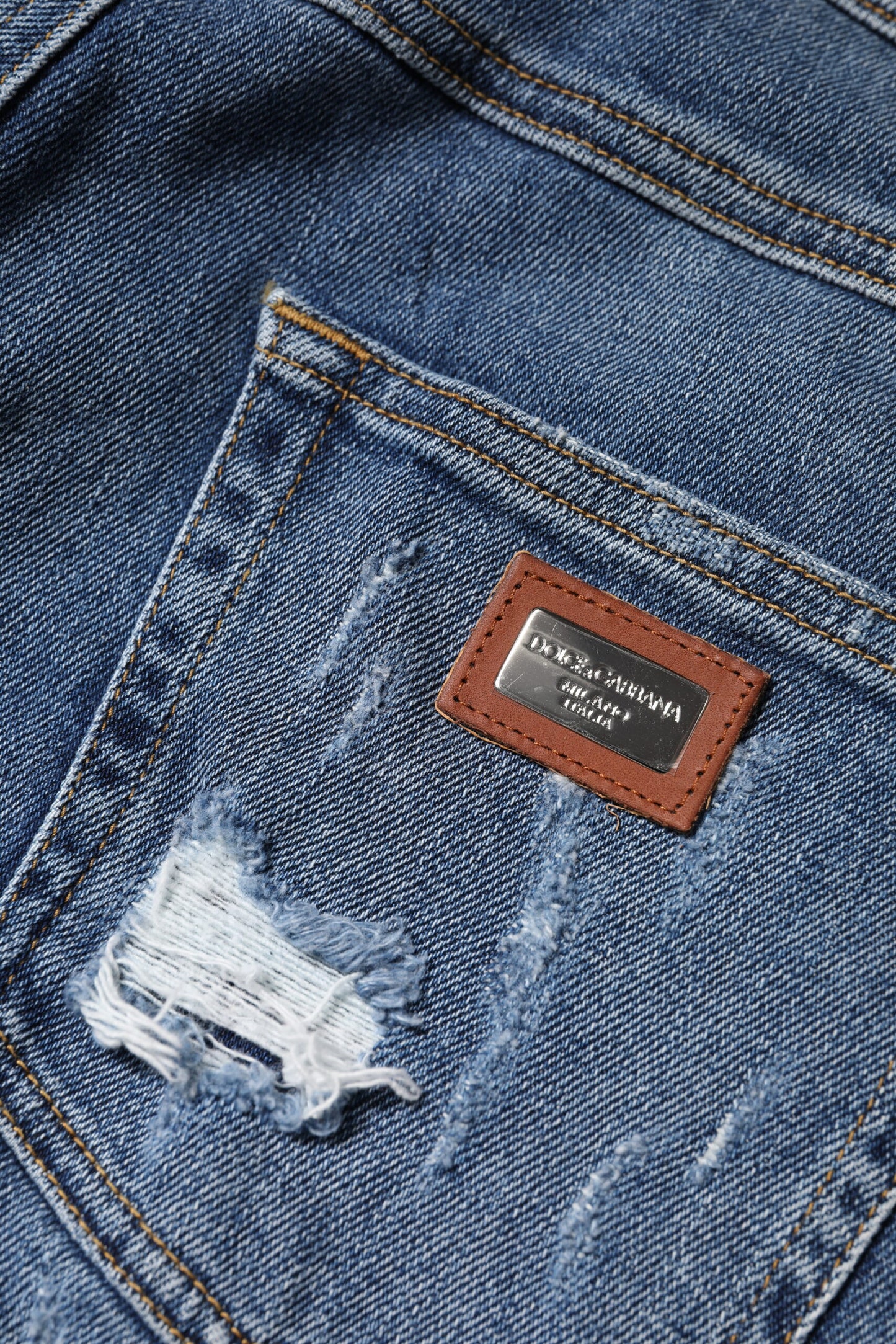 Jean taille basse en denim bleu déchiré Dolce & Gabbana