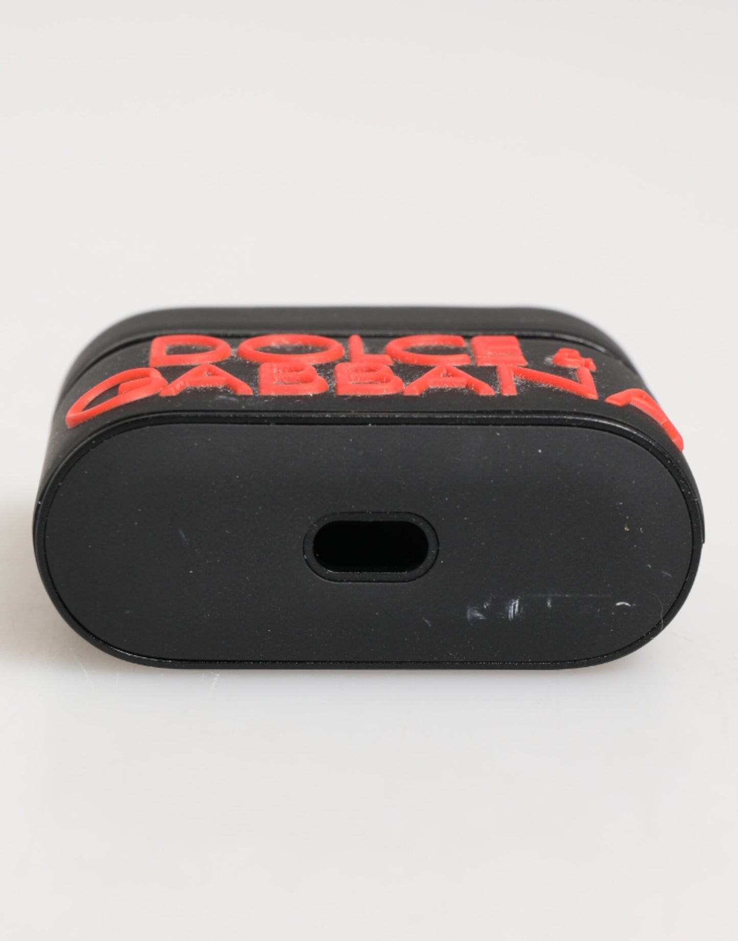 Étui pour Airpods Dolce & Gabbana en caoutchouc noir et orange avec logo en relief
