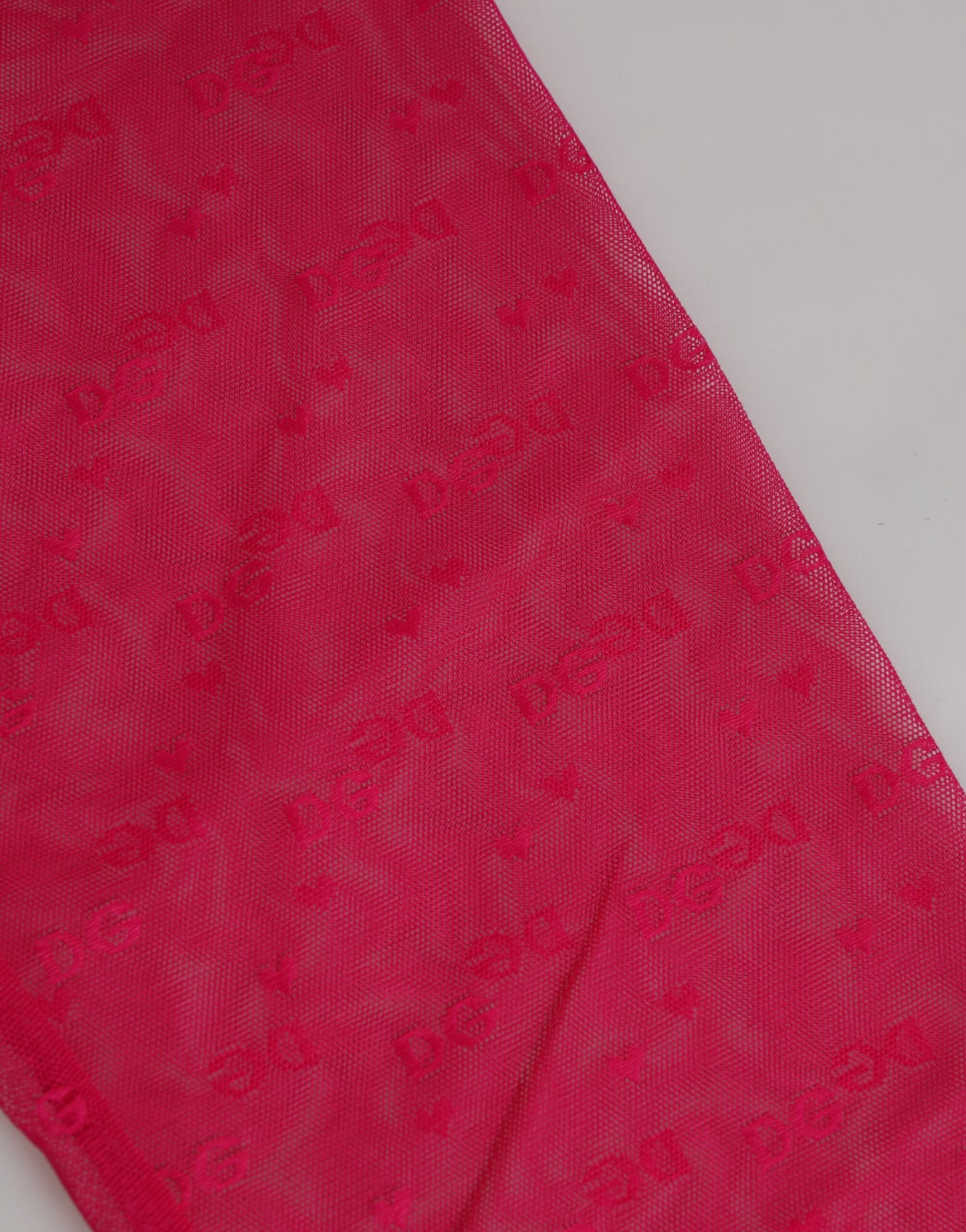 Dolce & Gabbana – Enge Midihose aus Spitze mit Logo in Fuchsia
